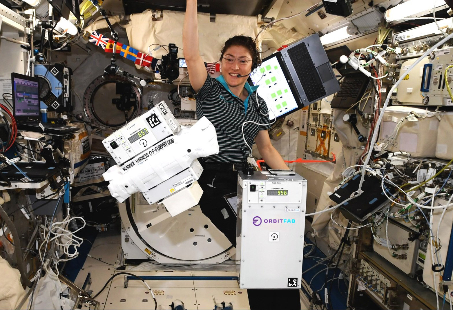 Orbit Fab's FURPHY mission payloads floating on the ISS with astronaut
