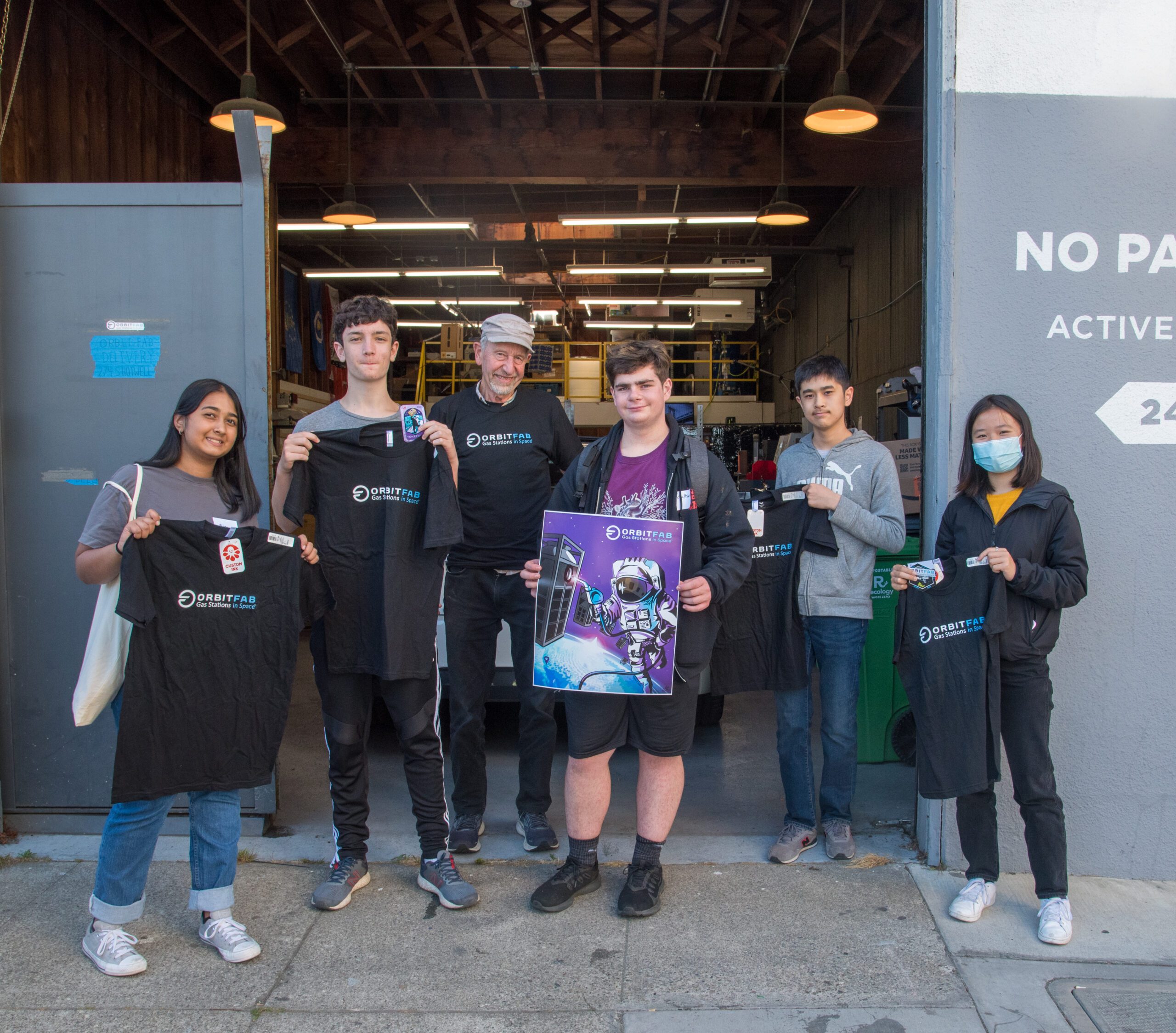 Group photo of Orbit Fab open house in San Francisco along with robotics high school students