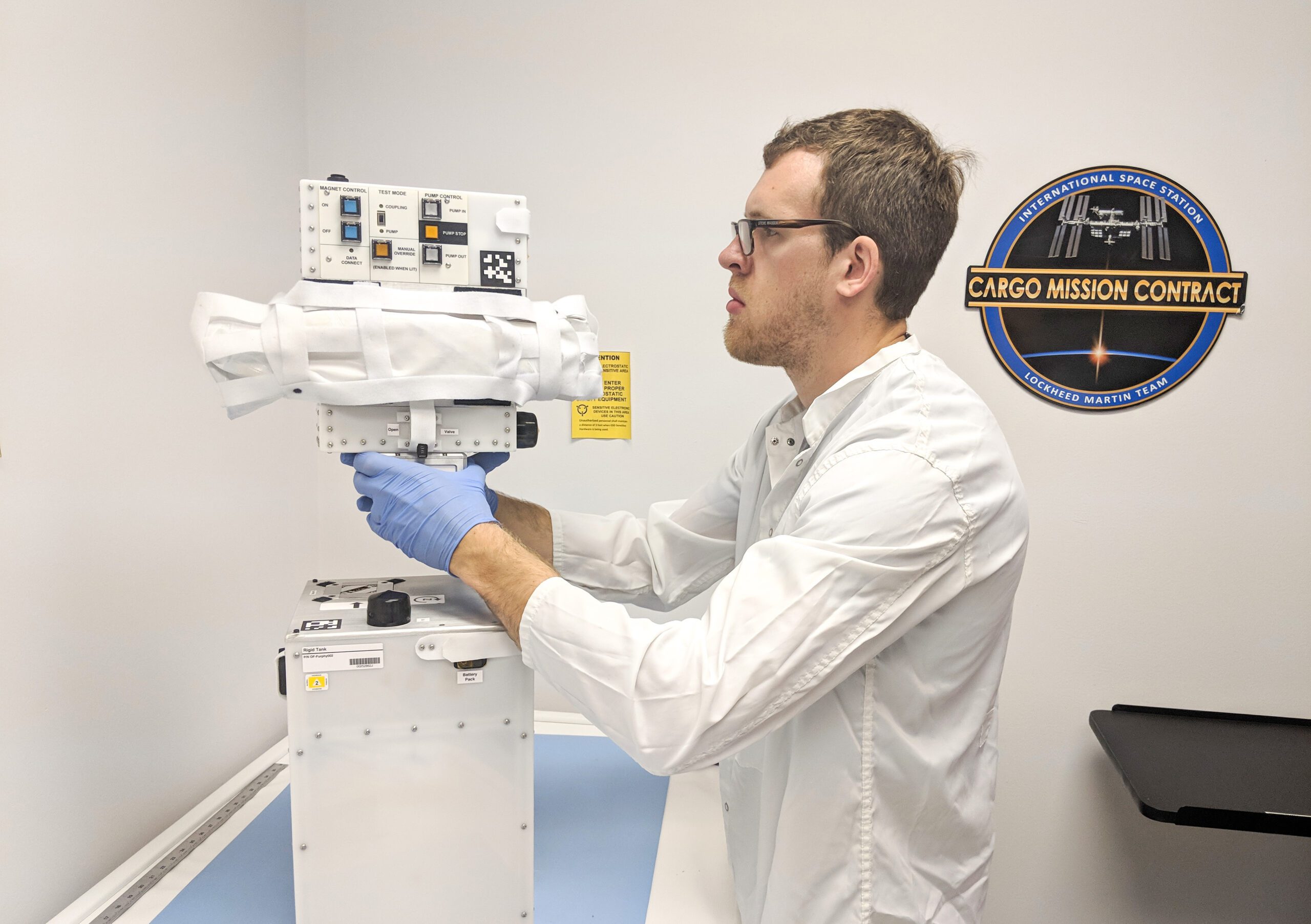 Orbit Fab's FURPHY mission payload flight hardware in cleanroom with person
