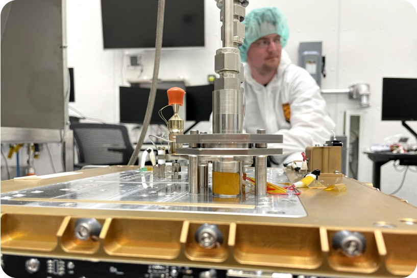 Close up of satellite hardware with person in background